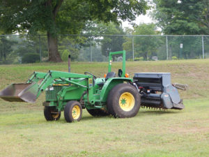 landscaping-tractor-with-aerator-and-spreader