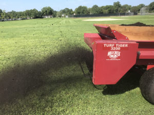 Spreading Compost - Lincoln Landscaping Inc.